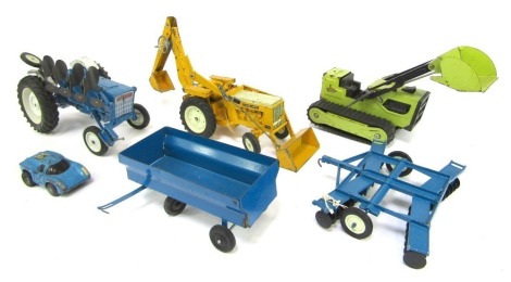 Ertl, Tonka and other diecast farming implements, to include an International 344 tractor with front dumper bucket and back hoe, Tonka bulldozer, Ford tractors, etc. (a quantity)