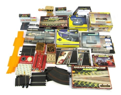 Scalextric boxed and unboxed accessories, including elevated crossover, Scalextric pole position sound control centre, C249 right angle crossing, electronic lap counter and timer, etc. (1 box)