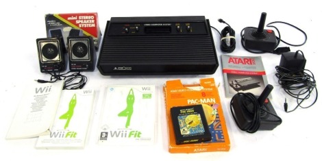 An Atari 2600, with two controllers, transformer, Pac-Man, and a copy of Wii Fit for the Nintendo Wii. (1 box)