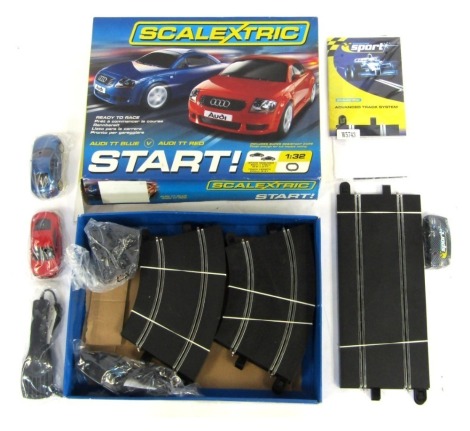 A Scalextric Audi TT Blue vs Audi TT Red Starter Set, boxed.