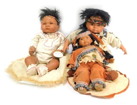 An ADG Little Wolf collectors doll stamped S.B.04, in Indian chief type dress, 42cm long and two other dolls, comprising Leonardo Collection child, and a further example, unmarked. (3)