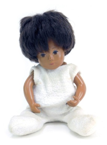 A 1970s Sasha doll, of girl in white dress, 25cm high.