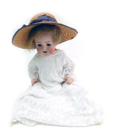 A Simon & Halbeg German porcelain bisque headed doll, with brown roll eyes and teeth, blonde hair with articulated limbs, in evening gown, stamped KV Germany 126, 47cm high.