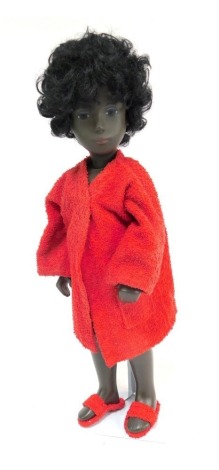 A 1970s Sasha doll, of lady with flowing black hair and blue eyes, in red dressing gown, on stand, 41cm high.