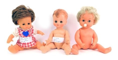 Three celluloid dolls, comprising Palitoy, Uniquca and another.