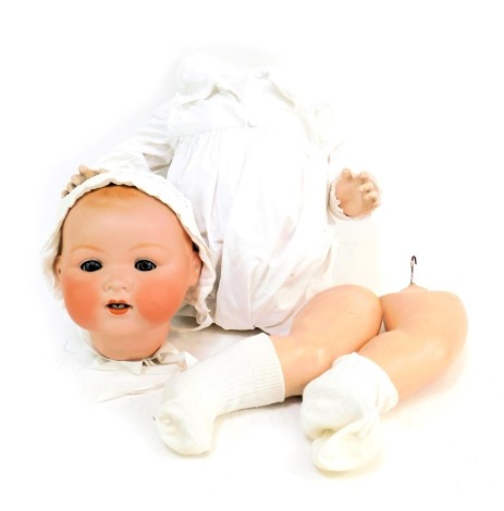 An Armand Marseille bisque headed doll, with roll blue eyes, number 351-A, with articulated limbs and body, deconstructed.