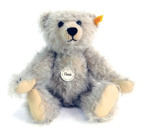 A Steiff Classic Teddy bear, with label and tag, 28cm high.