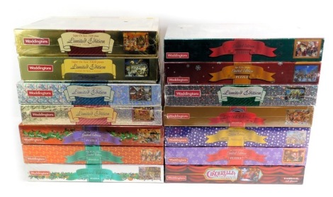 A group of Waddington's limited edition Christmas puzzles, in celophane wrap.