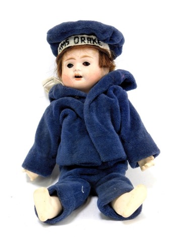 A German bisque headed doll, with rolled blue eyes and teeth, stamped RA6A 11-0, with articulated limbs, in HMS Drake sailors uniform, 24cm high.