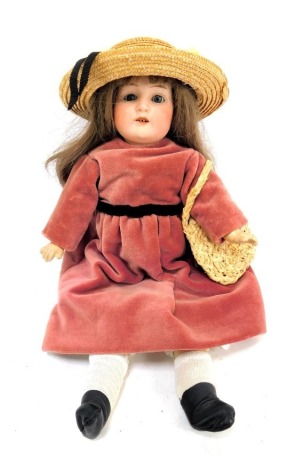 A C Hartmann German bisque headed doll, Globe Baby BRSM, with blue roll eyes and teeth, with articulated limbs in pink dress, 36cm high.