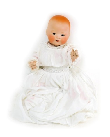 An Armand Marseille German bisque headed doll, with blue roll eyes and teeth, articulated limb body, head stamped AM Germany 351-3-2K, in white cloth evening gown, 25cm high.