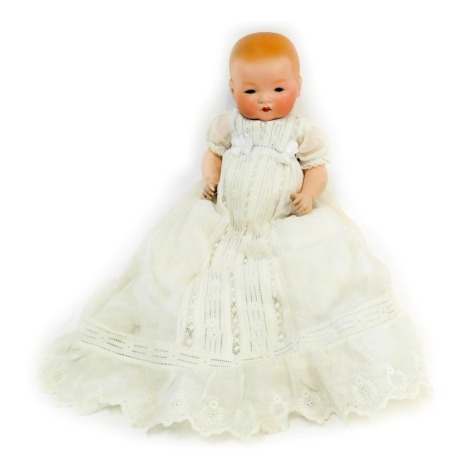 An Armand Marseille German bisque headed doll, with blue eyes, articulated limbs, head stamped AM Germany 341-3 1/2K, in lace gown, 36cm high.