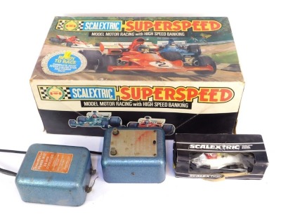 A Scalextric Super Speed Model Racing car kit, C547, and two additional power units, and a Scalextric Martini Brabham BT44B car, boxed. (4) - 4