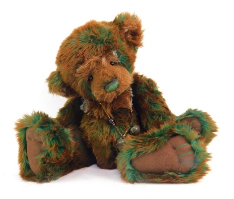 A Charlie Bears Eden Teddy bear, CB625179, with bell collar, brown and green plush jointed bear.