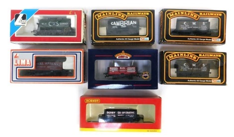 Lima Mainline and Hornby OO gauge rolling stock, comprising Bachmann five plank wagon, Mainline Railways seven plank wagon, Hornby five plank wagon Derby Co-operative, Lima 303175 wagon, two Mainline Railways seven plank wagons, and a Lima 305644, boxed. 