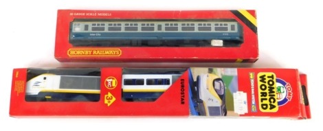 A Hornby Railways Intercity coach, R921, and a Tomy Tomica World Eurostar train, boxed. (2)