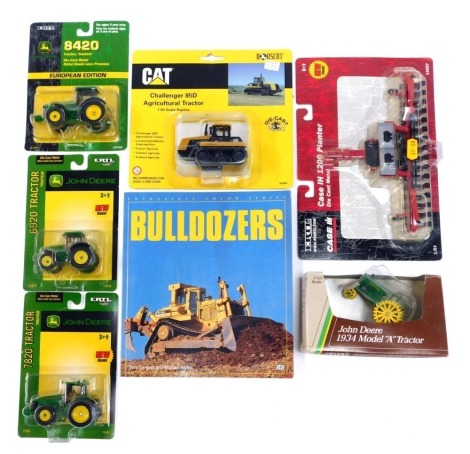 A group of agricultural diecast vehicles, comprising Ertl 1200 planter, Ertl John Deere 1934 model A tractor, Ertl 7820 John Deere tractor, Ertl 6920 John Deere tractor, Ertl European Edition 8240 John Deere tractor, CAT Challenger 85D agricultural tracto