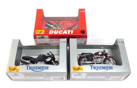 Three Maisto 1:18 scale models, comprising Triumph and Ducati, boxed. (3)