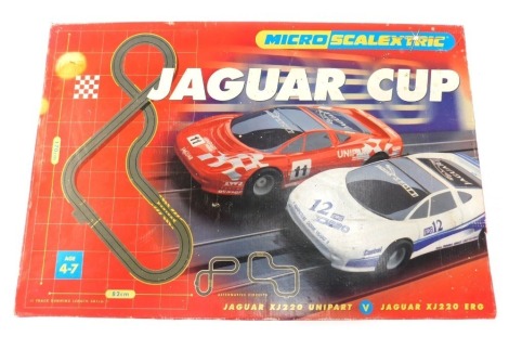 A Micro Scalextric Jaguar XJ 220 Jaguar cup set, boxed.