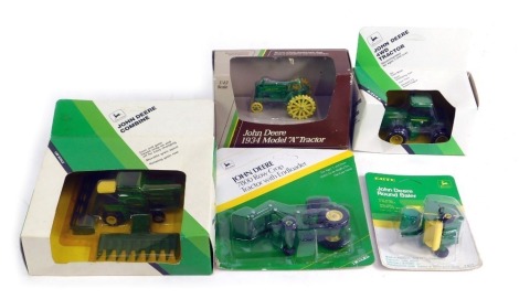 A group of agricultural diecast vehicles, comprising an Ertl John Deere round bailer, John Deere 7800 row drop tractor with end loader, John Deere combine, John Deere 1934 model A tractor, and a John Deere 4WD tractor, boxed. (5)