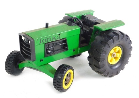 A Tonka Toys John Deere tractor.