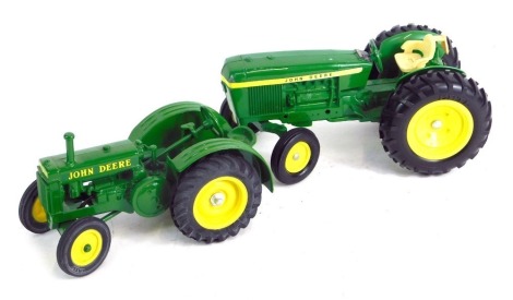 An Ertl John Deere tractor model, and another. (2)