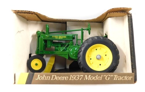 An Ertl John Deere 1937 model G tractor, boxed.