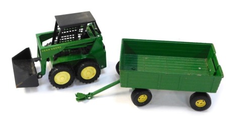 An Ertl John Deere tractor, number 5889, and a twin axle trailer. (2)