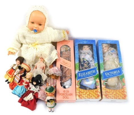 Various dolls, comprising two bisque headed dolls, Victoria and Elizabeth, a 1960s plastic doll, Heritage Mint collection Heather, and various small European dolls. (1 box)