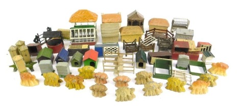 A group of painted metal farm buildings, haystacks, wheatsheafs, outbuildings, etc. (1 tray)