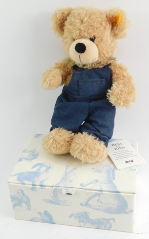 A Steiff mohair teddy bear, in beige, with dungarees, boxed.