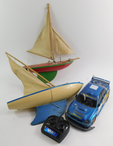 Two Star Yachts pond yachts, and a Nikko Subaru Impreza remote controlled car.