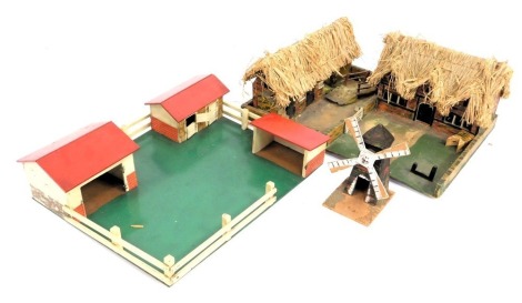 A group of thatched cottage farm models, with windmill. (1 box)