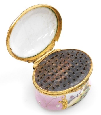 A late 18thC French enamel nutmeg grater, of oval form, decorated with landscape reserves against a pale pink ground, the hinged lid opening to reveal a metal grater, enclosing an interior with "Gage de mon amitie" to the base, 47mm wide. - 3