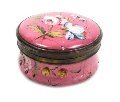 A late 18thC Bilston enamel snuff box, of cylindrical form, decorated with floral sprays, on a rose pink ground, 50mm diameter. (AF)