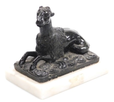 After The Antique (19thC). A green serpentine sculpture of a sea goat, modelled in recumbent pose, on a bed of waves, raised on a white marble base, 16.5cm wide.