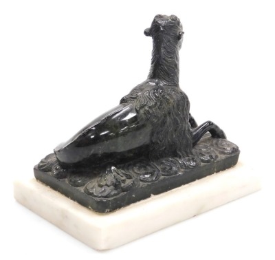 After The Antique (19thC). A green serpentine sculpture of a sea goat, modelled in recumbent pose, on a bed of waves, raised on a white marble base, 16.5cm wide. - 2