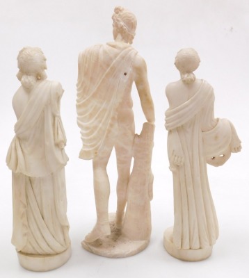 After The Antique. An alabaster sculpture of The Apollo Belvedere, 45cm high, and two further figures after The Antique, of goddesses, raised on circular bases, 37.5cm high. (AF, 3) - 2