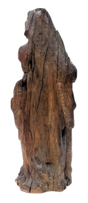 An 18thC Flemish wooden carving, of a lady in Renaissance attire, carved standing against a tree, 64cm high. - 2