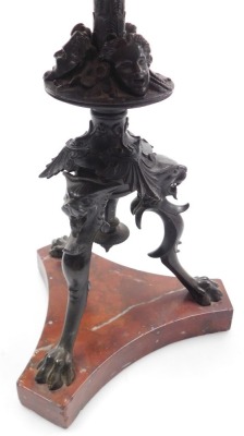 A late 19thC French bronze table lamp, of cast fluted column form, with masks and scrolling leaves, raised on three lion's head and paw feet, above a red marble triform base, with shade, 59cm high. - 5