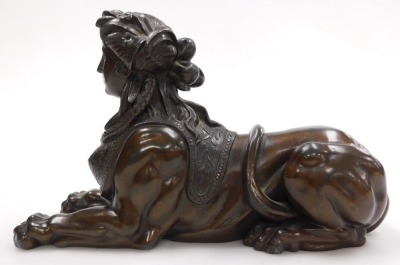 A late 19thC French hollow cast bronze of a sphinx, cast recumbent, with a woman's head bound with flowers and bull rushes, 26cm wide. - 2