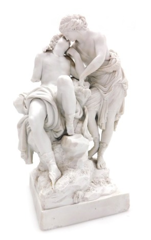 A late 18thC bisque porcelain figure group of Diana and Endymion, probably Meissen, showing the sleeping Endymion, seated on a rock, Diana standing and bending over his head, raised on a square base, incised marks verso, 30cm high. (AF)