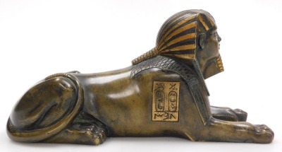 A 19thC polished bronzed figure of a sphinx, in recumbent pose, engraved with panels of hieroglyphics, 25cm wide. - 2