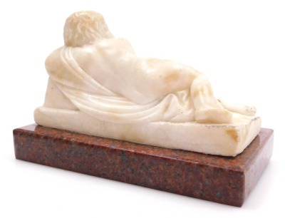 An early 19thC alabaster figure of a sleeping Cupid, after Du Quesnoy, carved recumbent on a draped raised cushion, the bow in his right hand, raised on a red marble base, 18cm wide. - 2