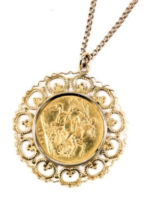 A Queen Victoria young head gold sovereign 1879, in a circular filigree round mount, yellow metal, on a 9ct gold curb link neck chain, with bolt ring clasp, 14.5g all in.