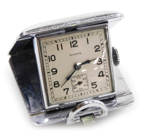 An early 20thC Suizex chrome cased travel clock, the square silvered dial bearing Arabic numerals, subsidiary seconds dial, the rectangular case with engine turned decoration, 36mm wide.