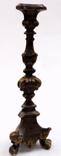 An 18thC European carved and gilt wood altar candlestick, of Baroque form, raised on three scrolled feet, 53cm high.