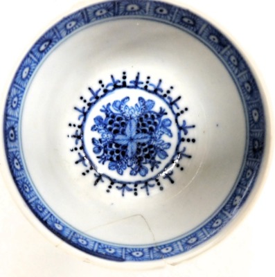 A pair of 18thC blue and white tea bowls and saucers, decorated with sprays, flowers and Buddhist emblems. (AF) - 6