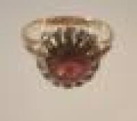A diamond and garnet set cluster dress ring
