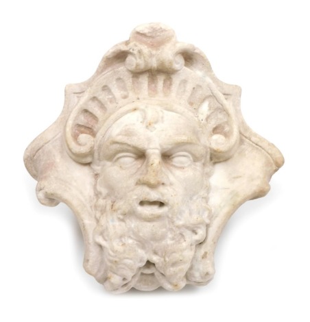 An 18thC Continental stone carved mask of a satyr, 20cm high.